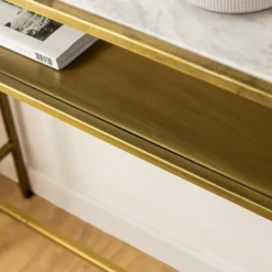 Table Console<Made in Meubles Console en métal doré et marbre Timéo